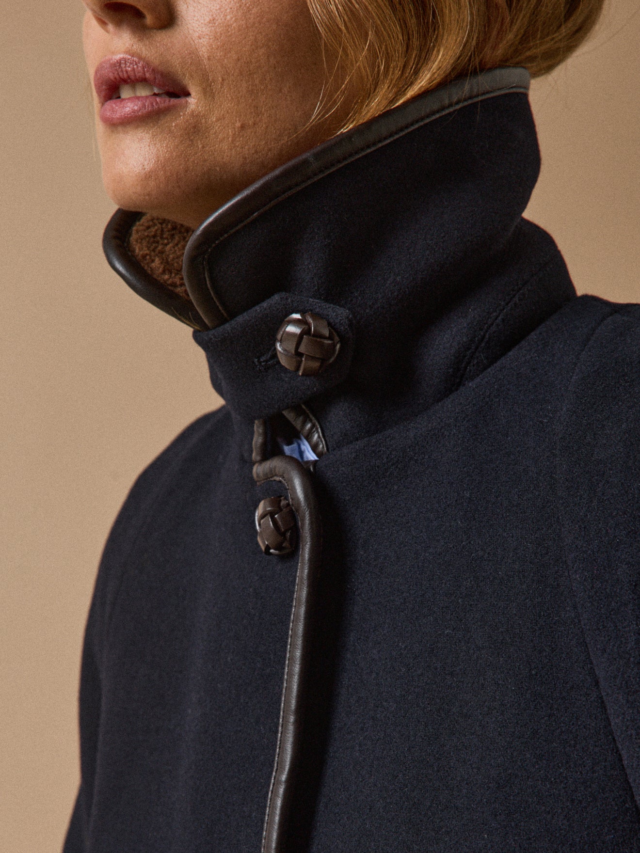 Women's coat with trimmed sherpa lining