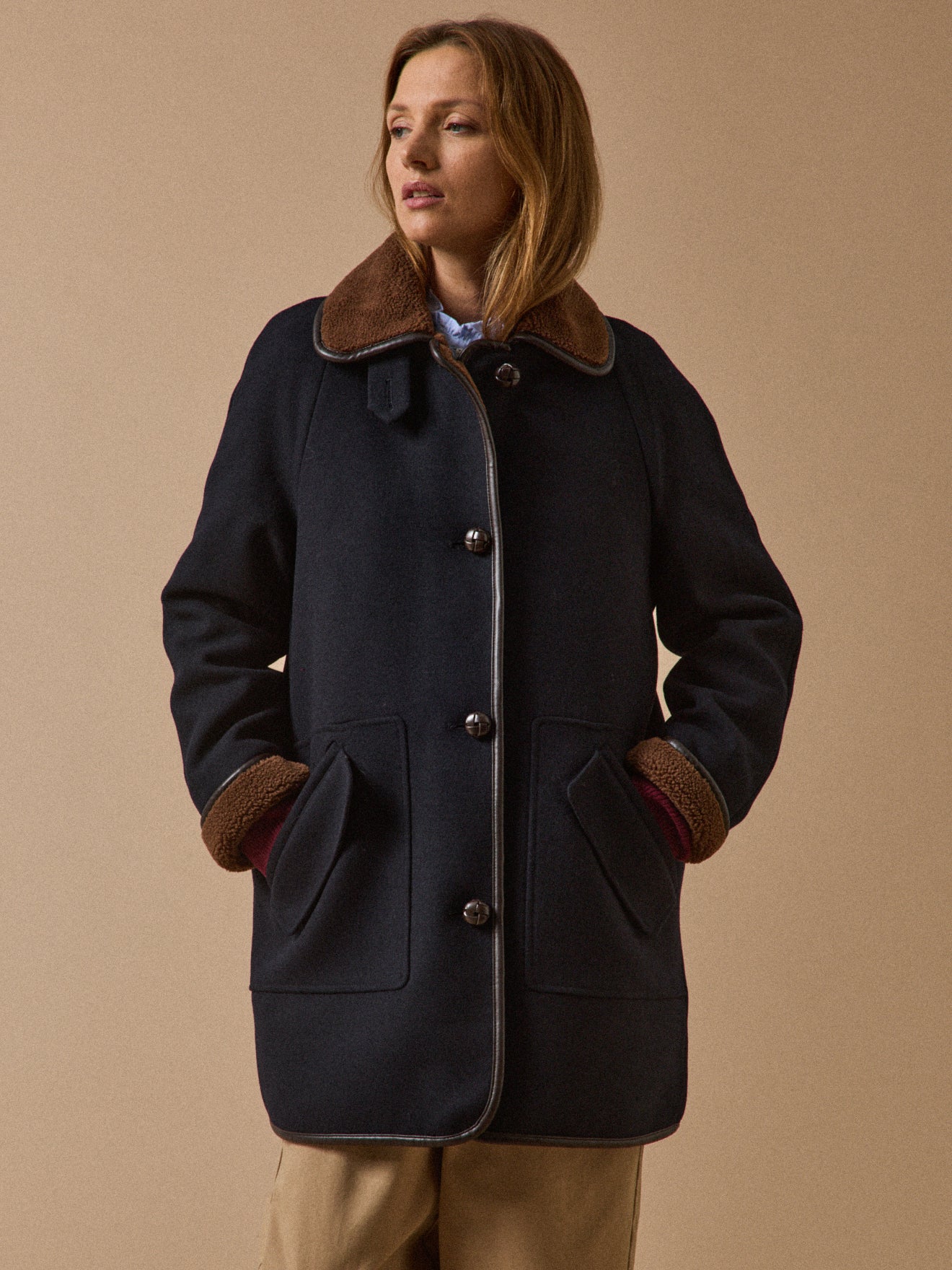 Women's coat with trimmed sherpa lining