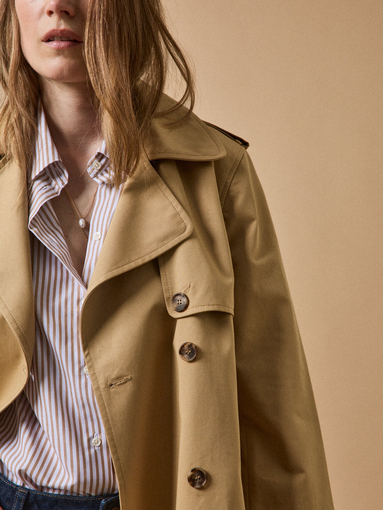 Women's long organic cotton trench coat with notched lapels