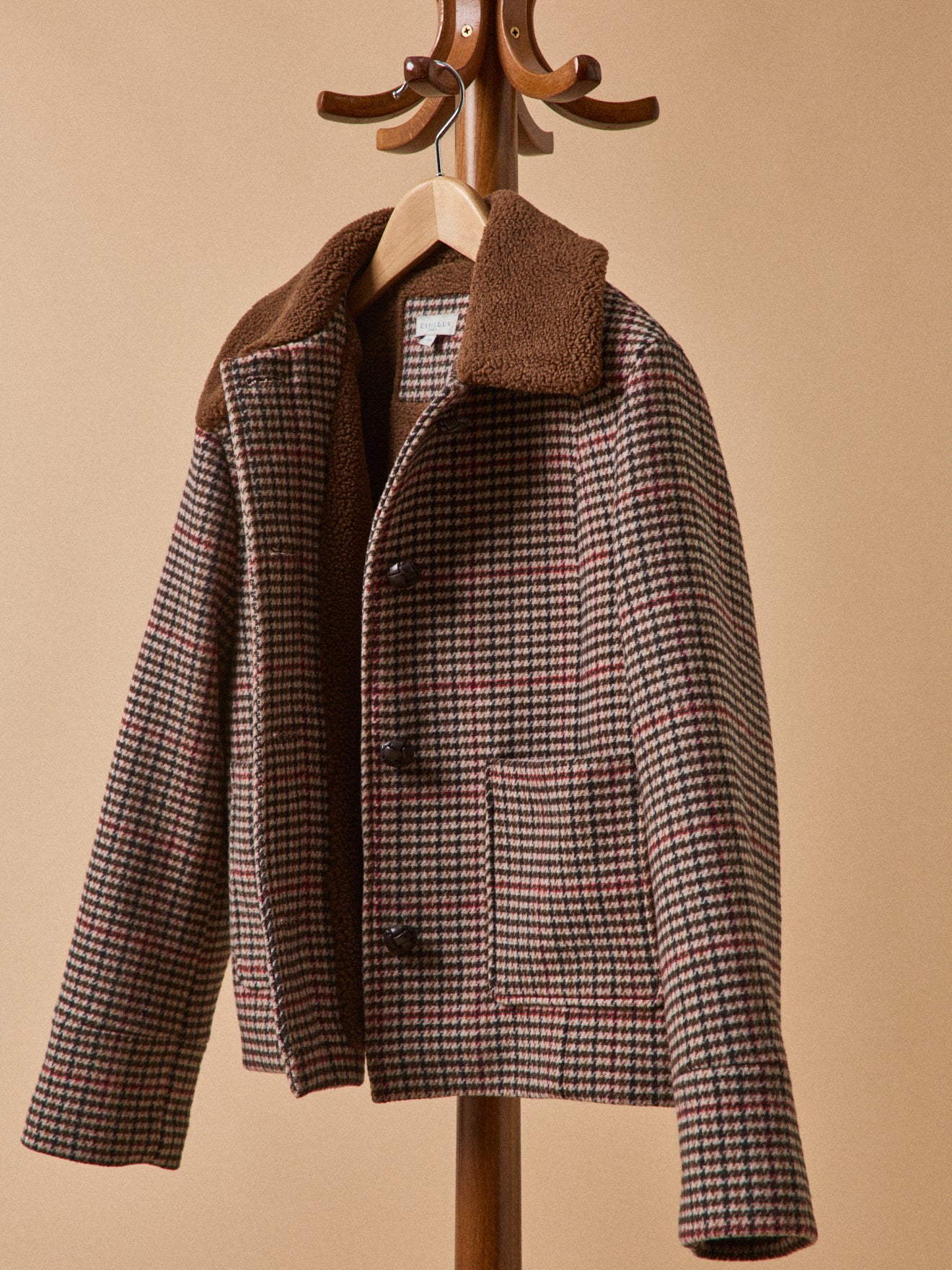 Women's short checked woolen coat with faux-fur lining