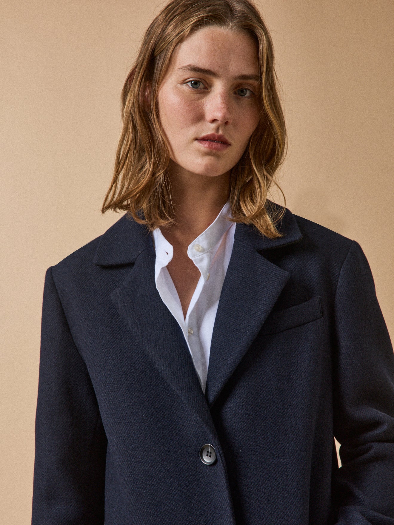 Women's long plain woolen coat with notched lapels