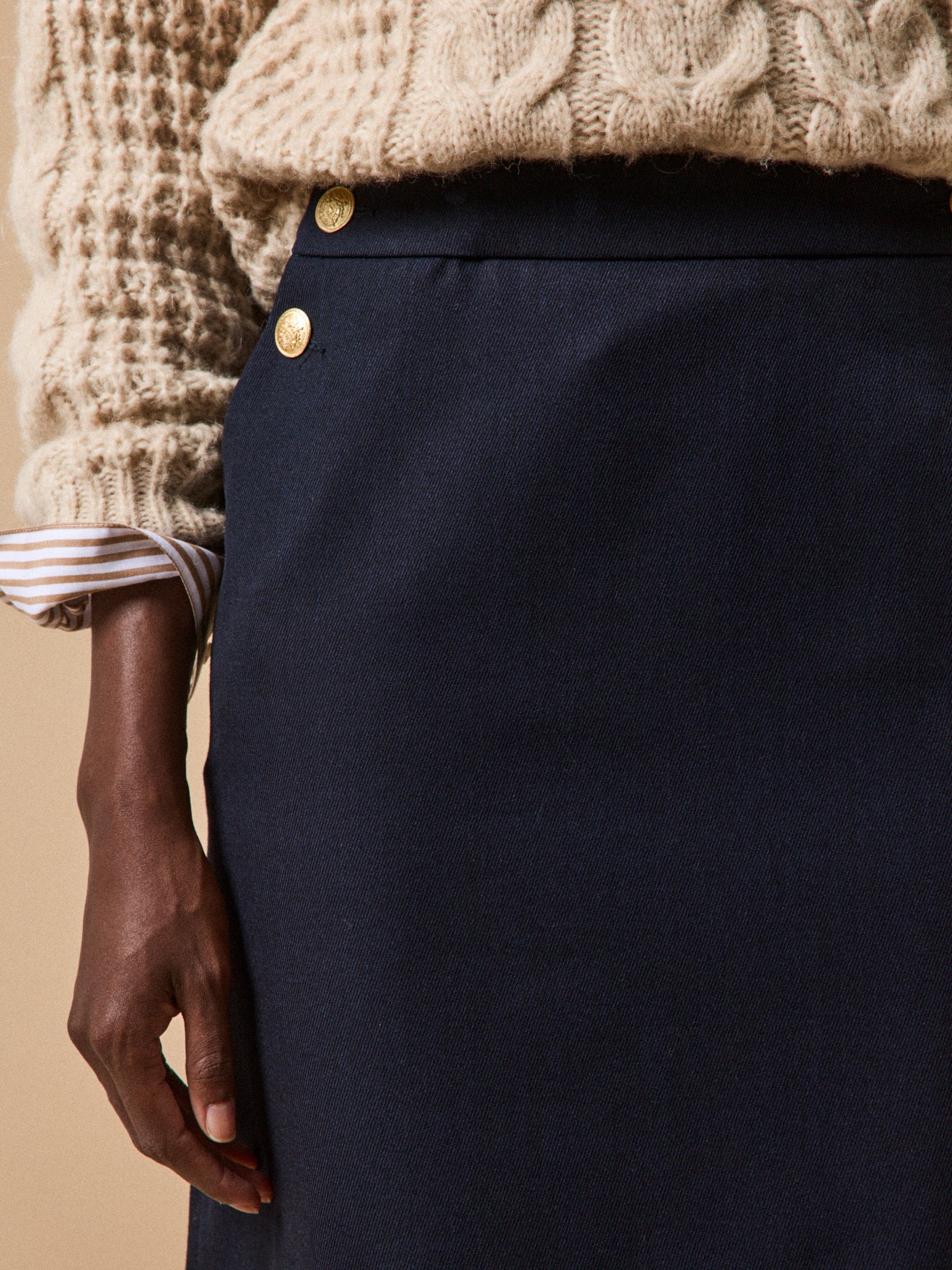 Women's short sailor-style skirt with golden buttons