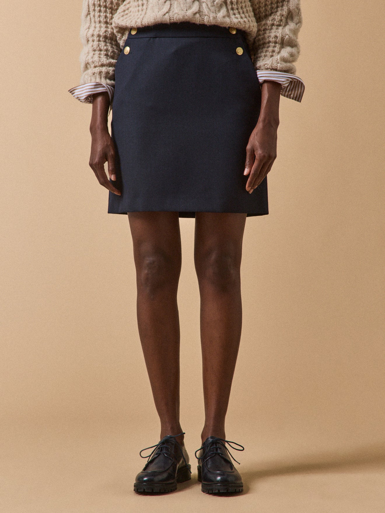 Women's short sailor-style skirt with golden buttons