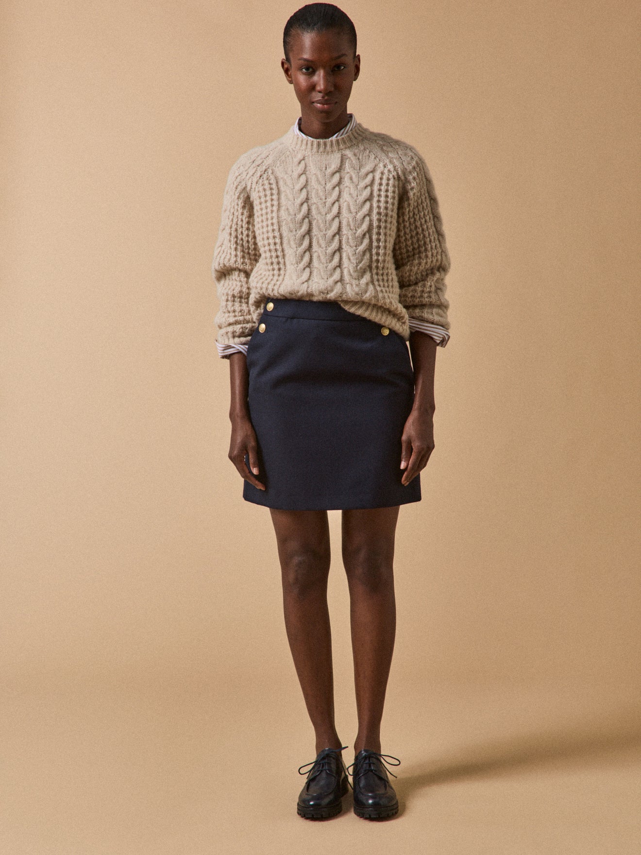 Women's short sailor-style skirt with golden buttons