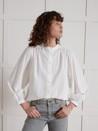 Women's blouse made with plain, flowing seersucker