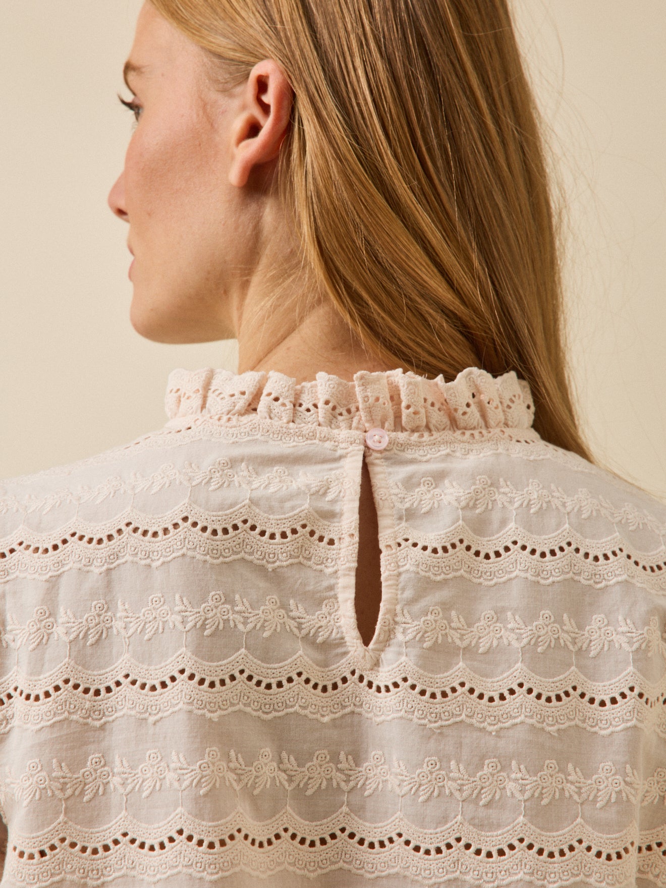 Women's broderie anglaise top with ruffled neckline