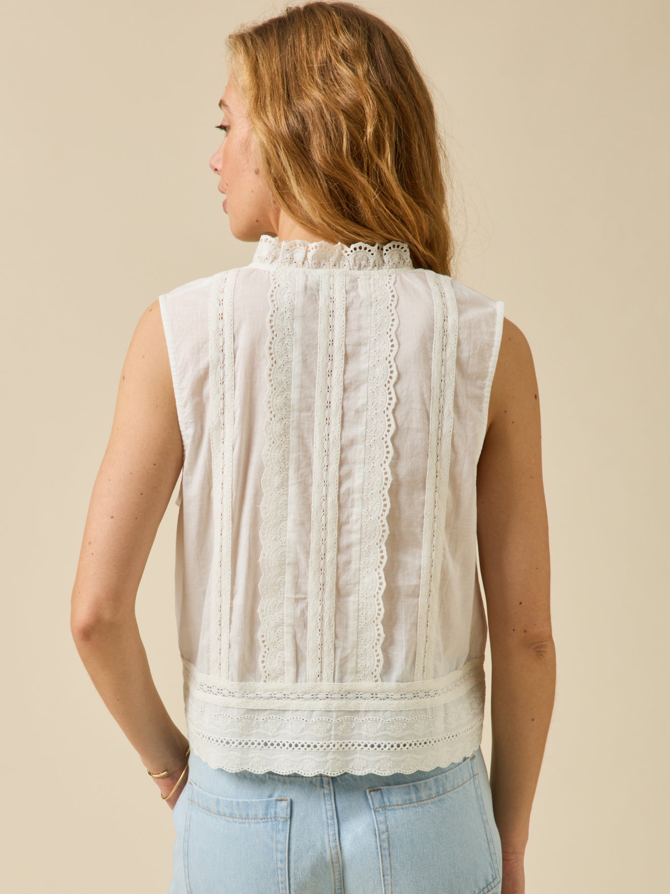 Women's button-up sleeveless embroidered top