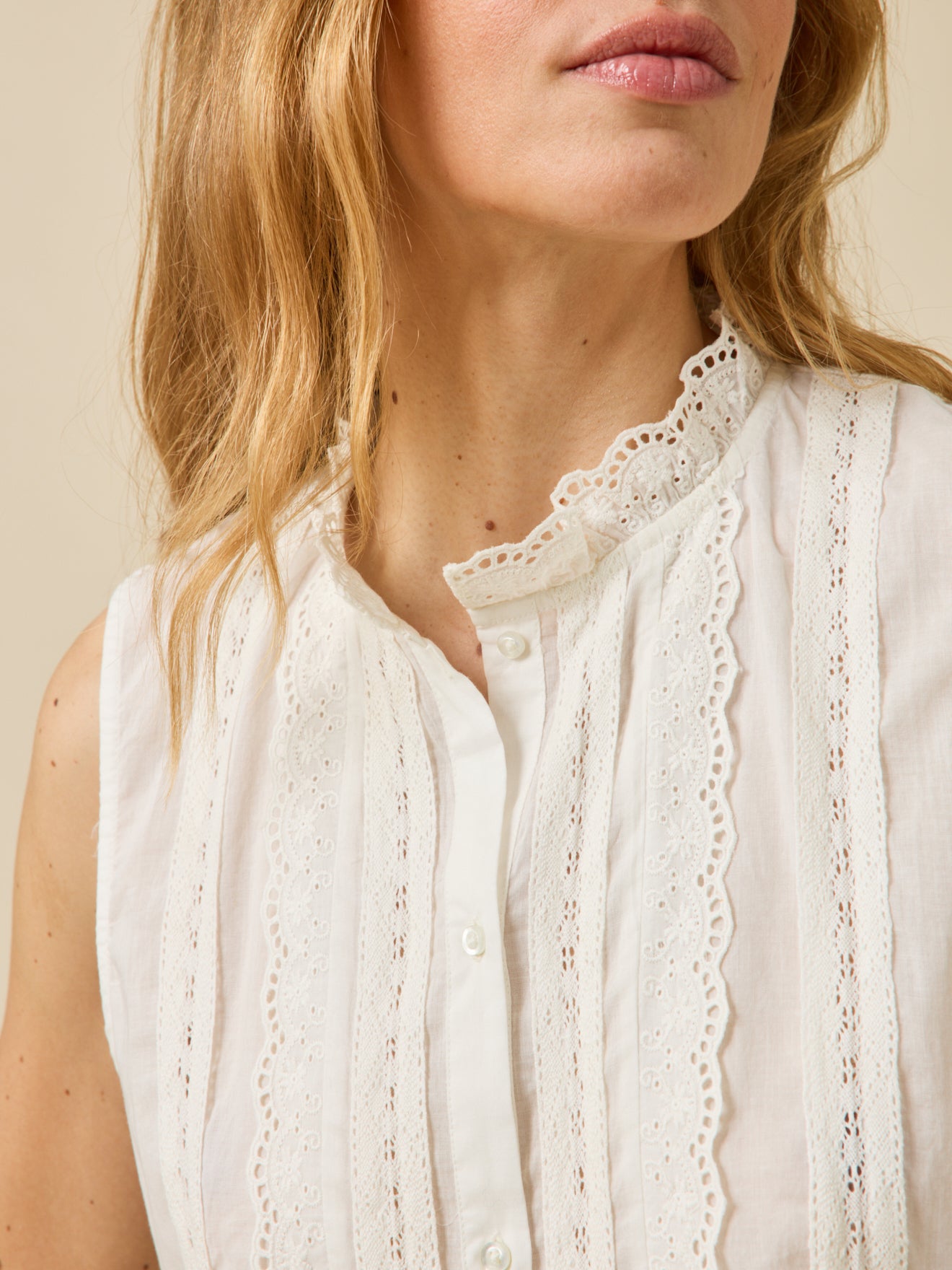 Women's button-up sleeveless embroidered top