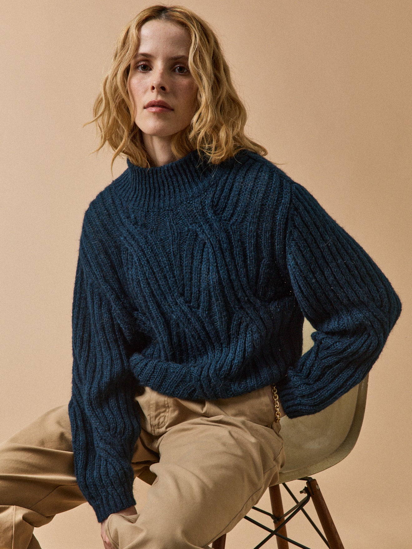 Women's cable knit sweater with high neckline