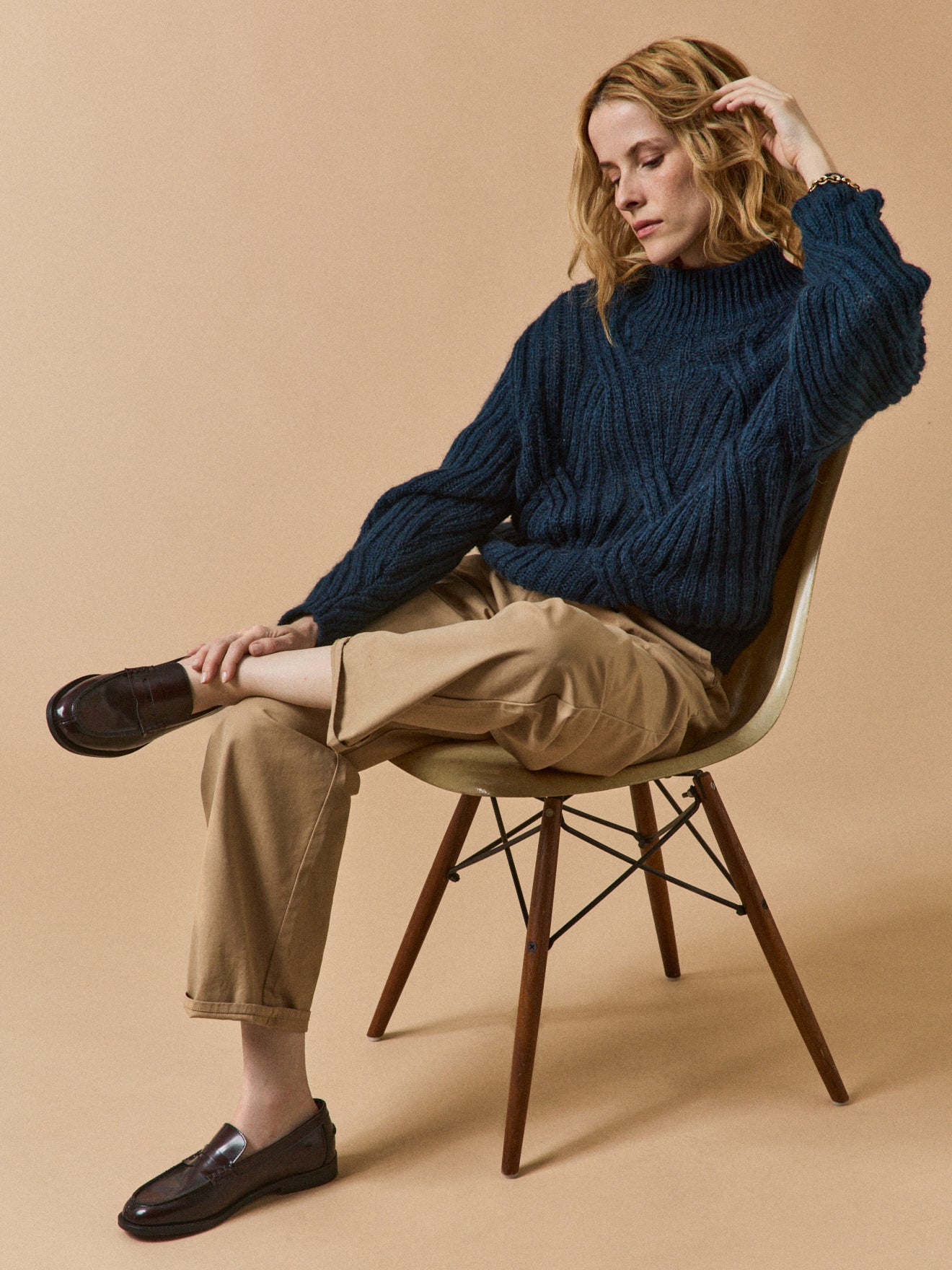 Women's cable knit sweater with high neckline