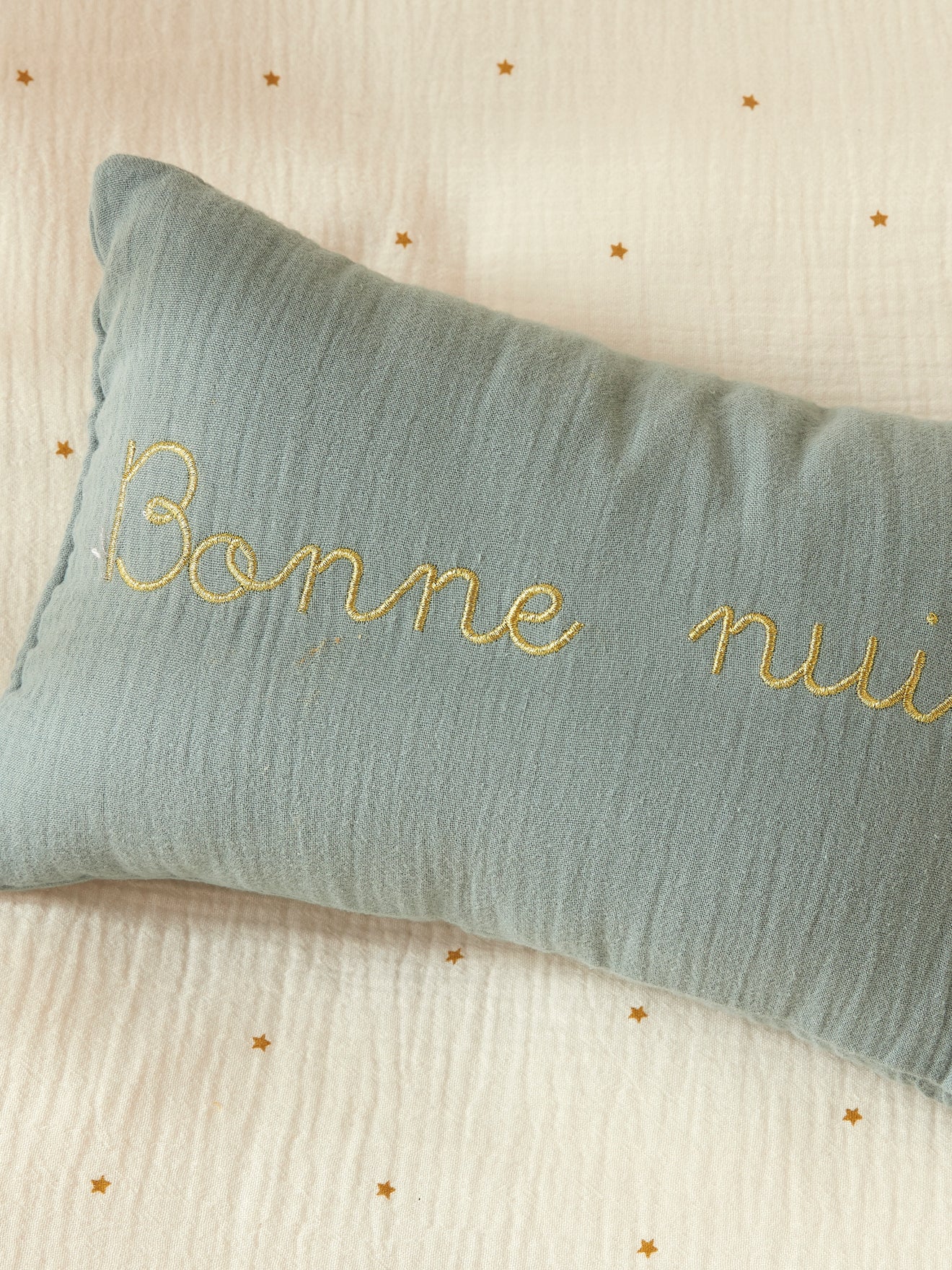 Small cotton gauze cushion with golden embroidery