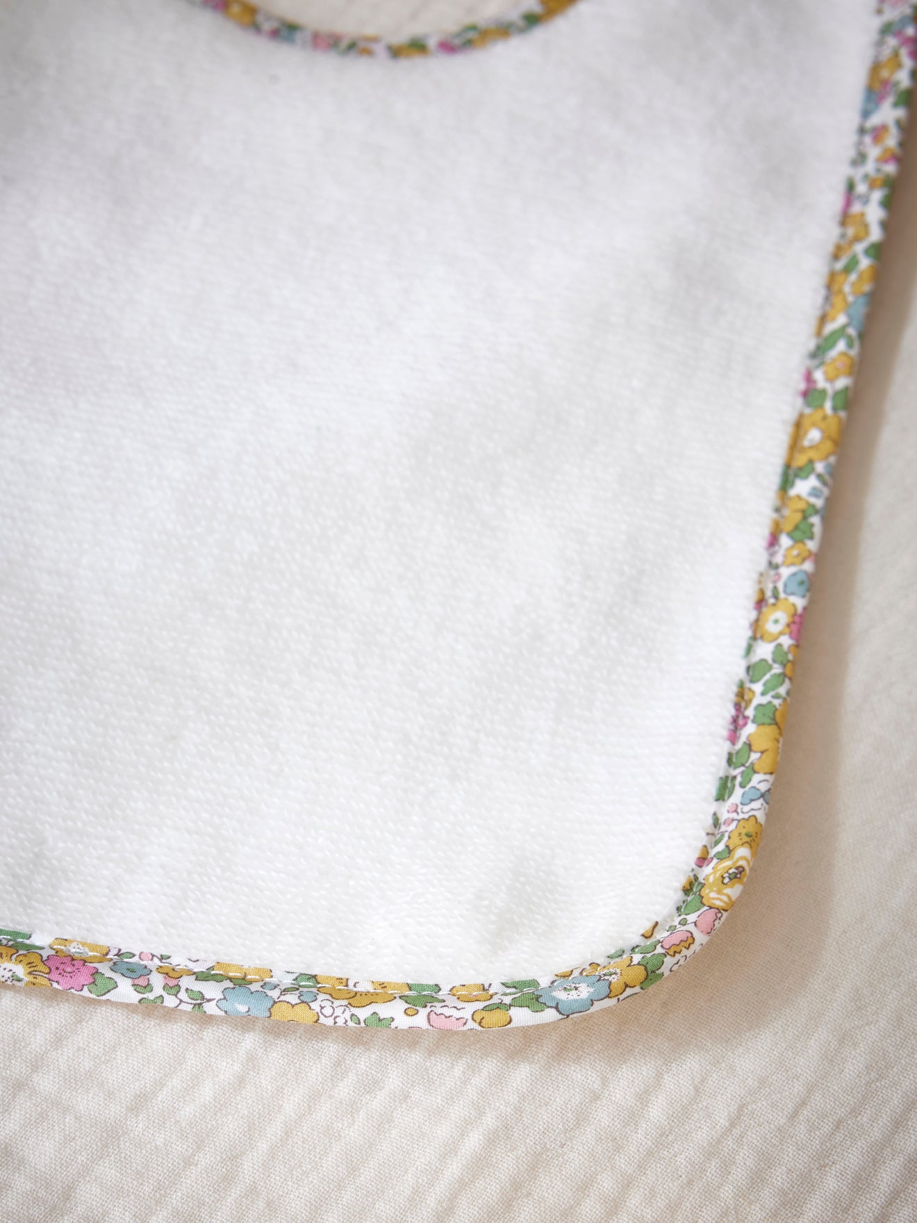 Towelling bib and trim made with Liberty fabric