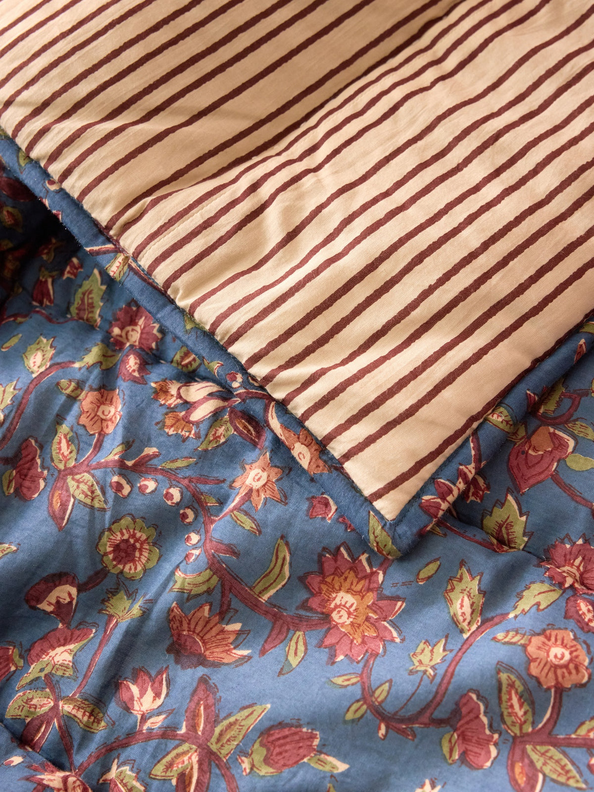 Reversible striped and Indian fabric quilted boutis