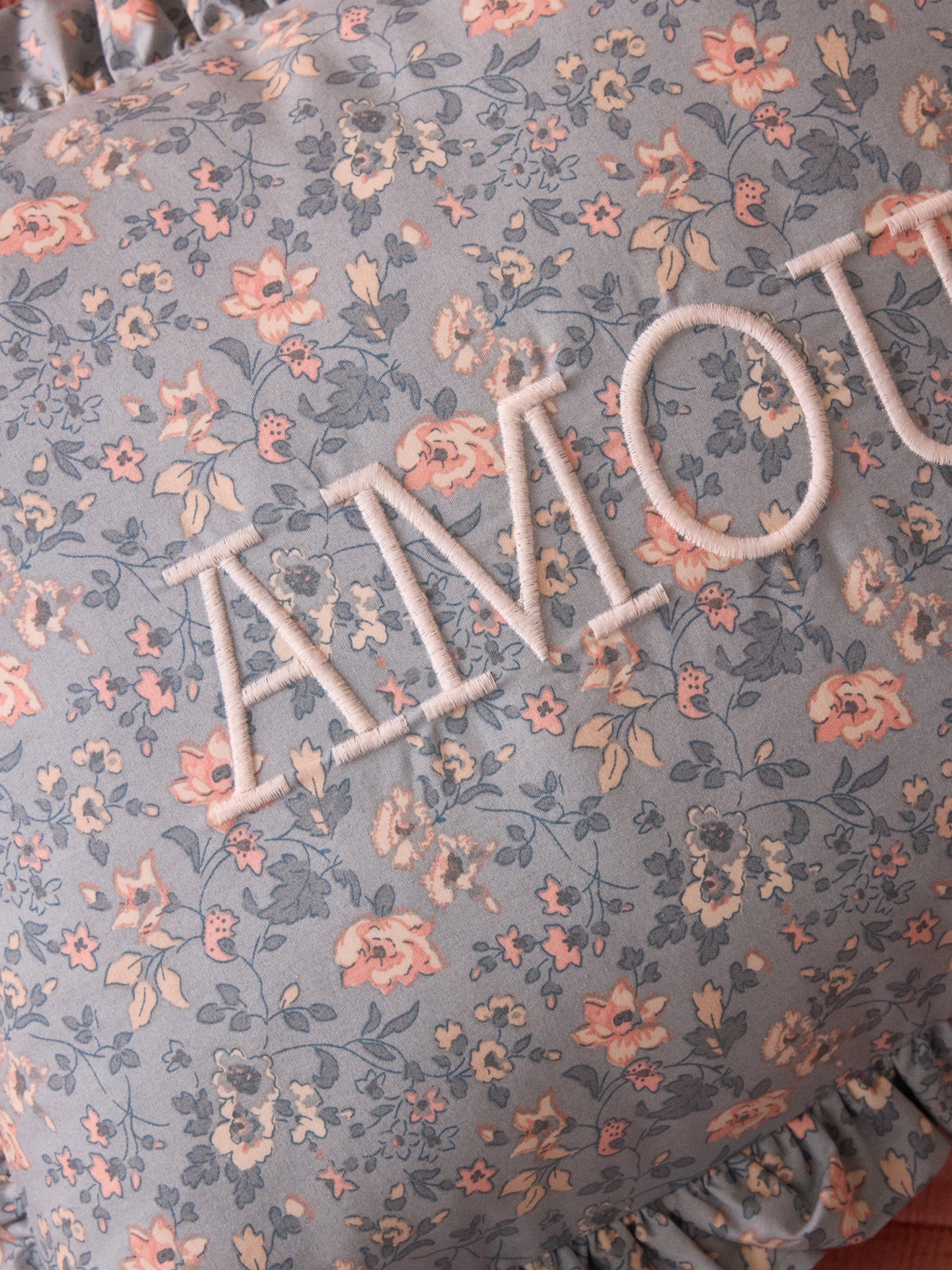 Cushion with Amour embroidery