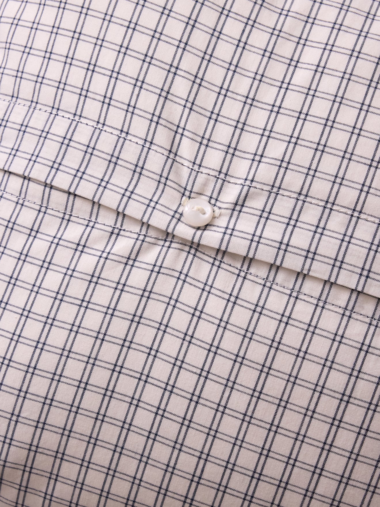 Housse de coussin petits carreaux brodée