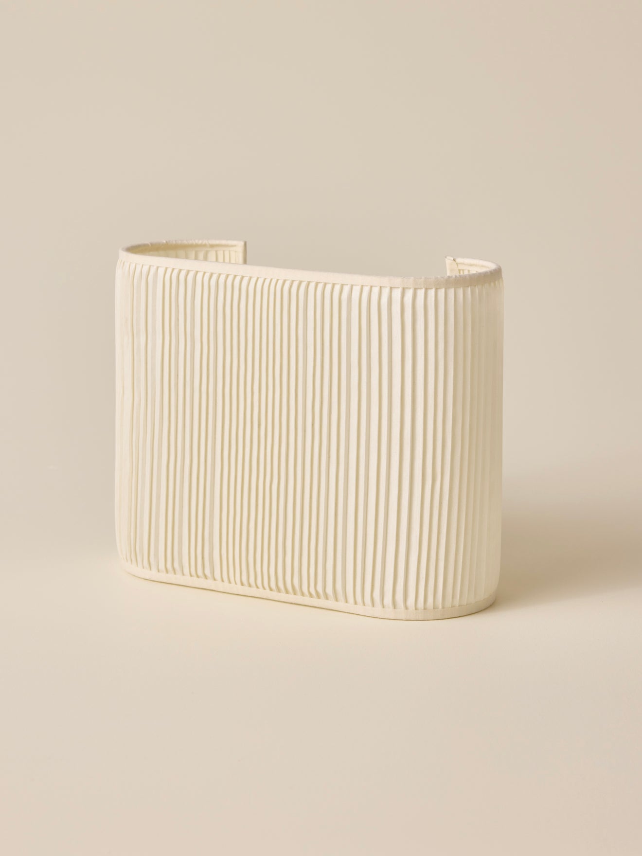 Oval pleated wall lamp