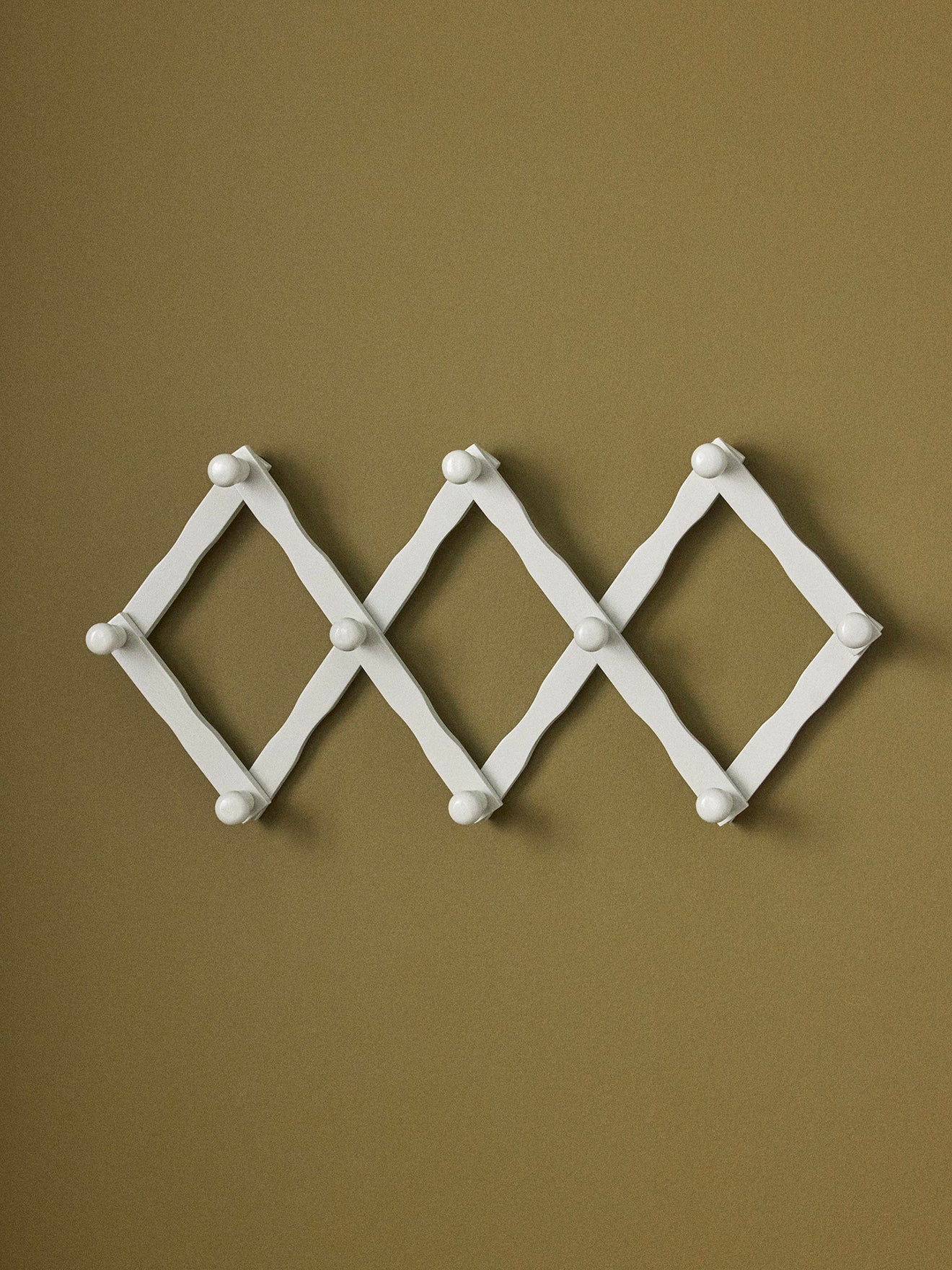 Wooden accordion coat hook