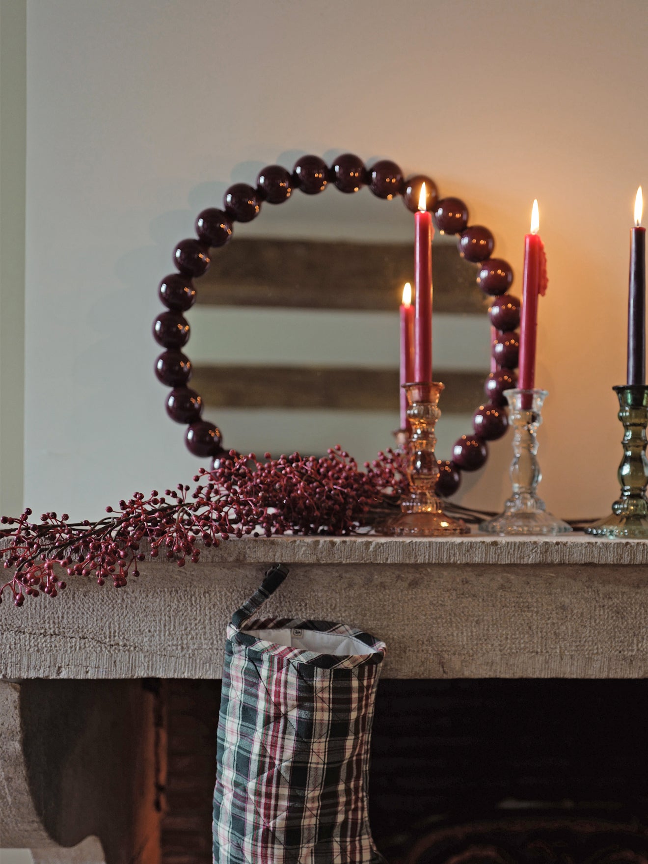 Round mirror trimmed with wooden balls