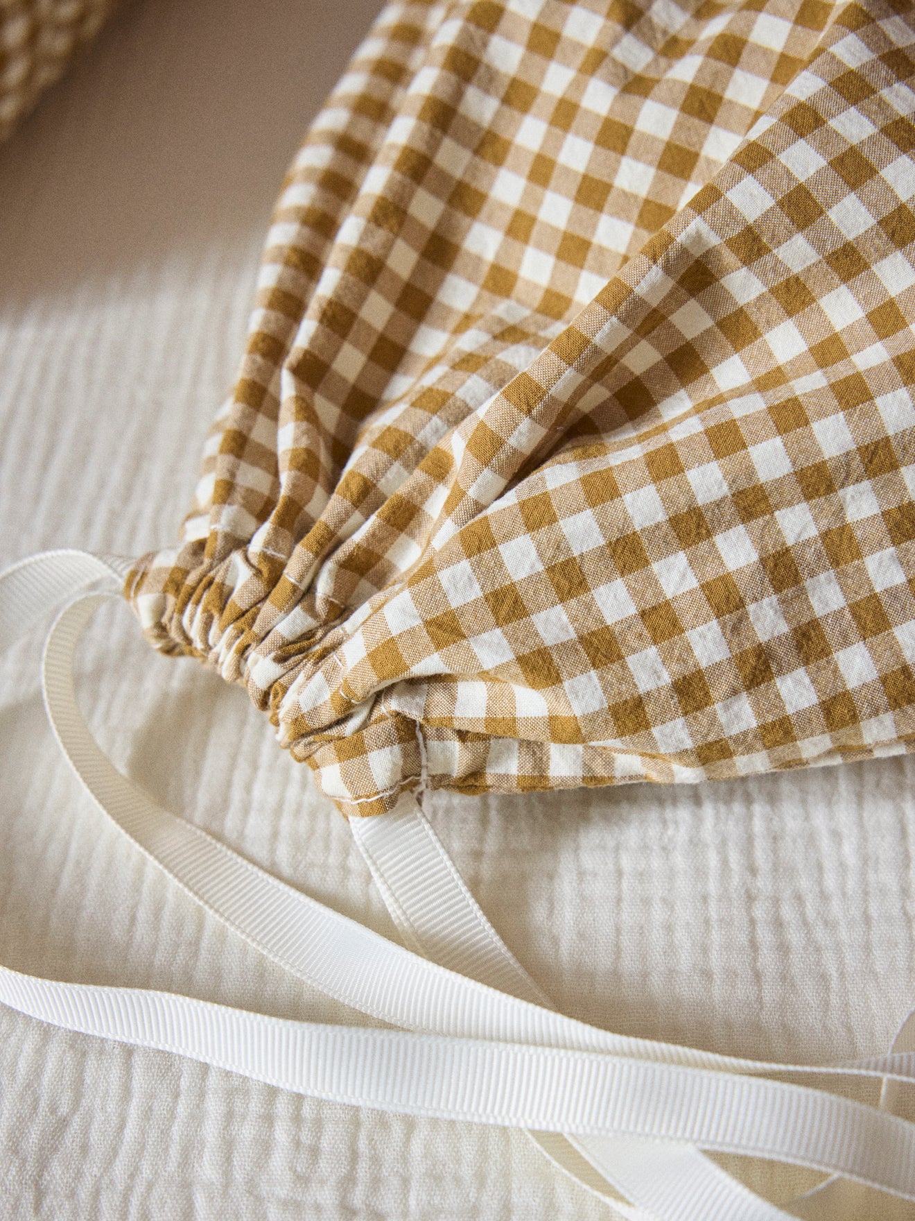 Gingham-checked cotton toiletries bag