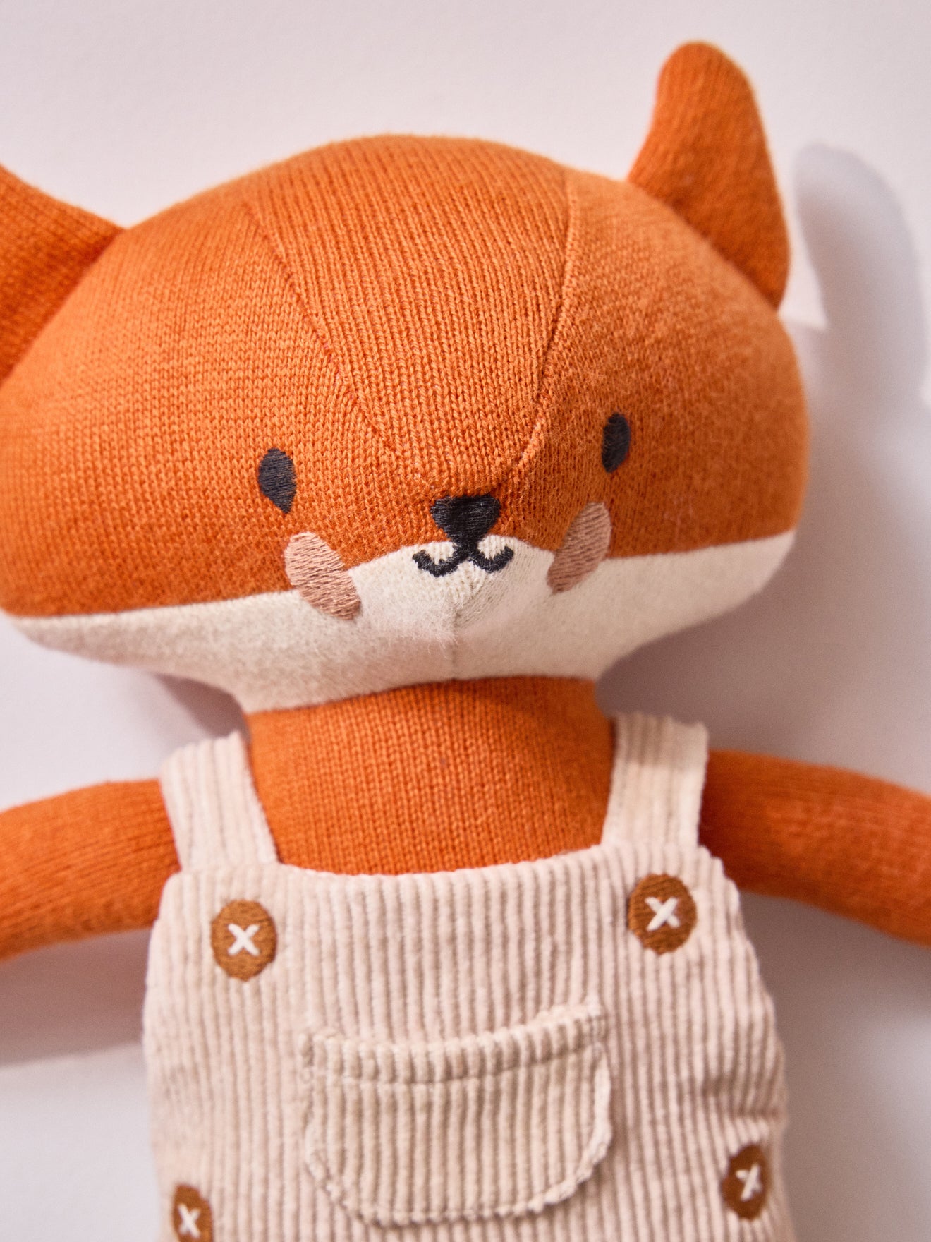 Knit fabric fox plush toy with velour overalls
