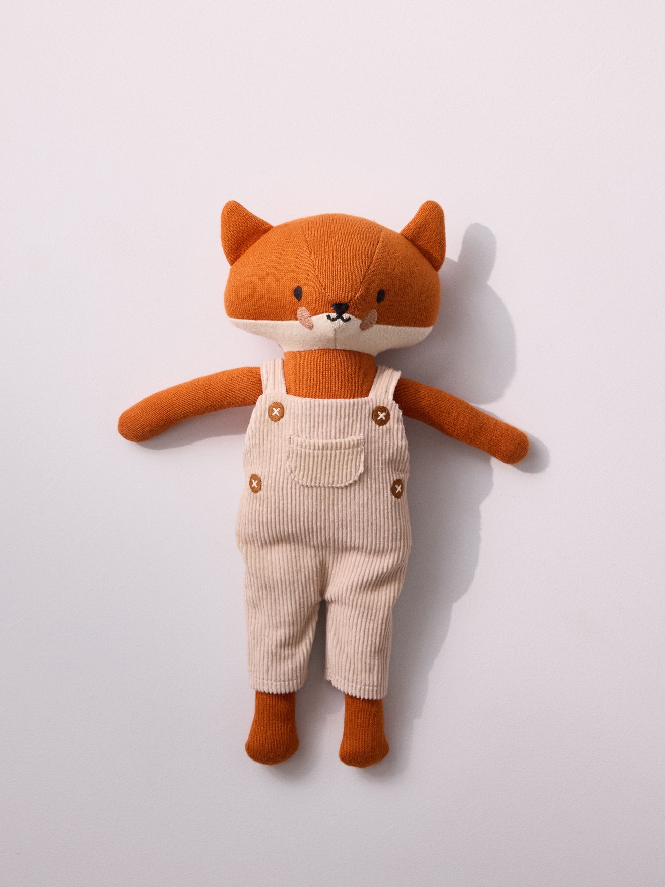 Knit fabric fox plush toy with velour overalls