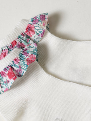Baby's socks with a Clare Rich floral motif made with Liberty fabric