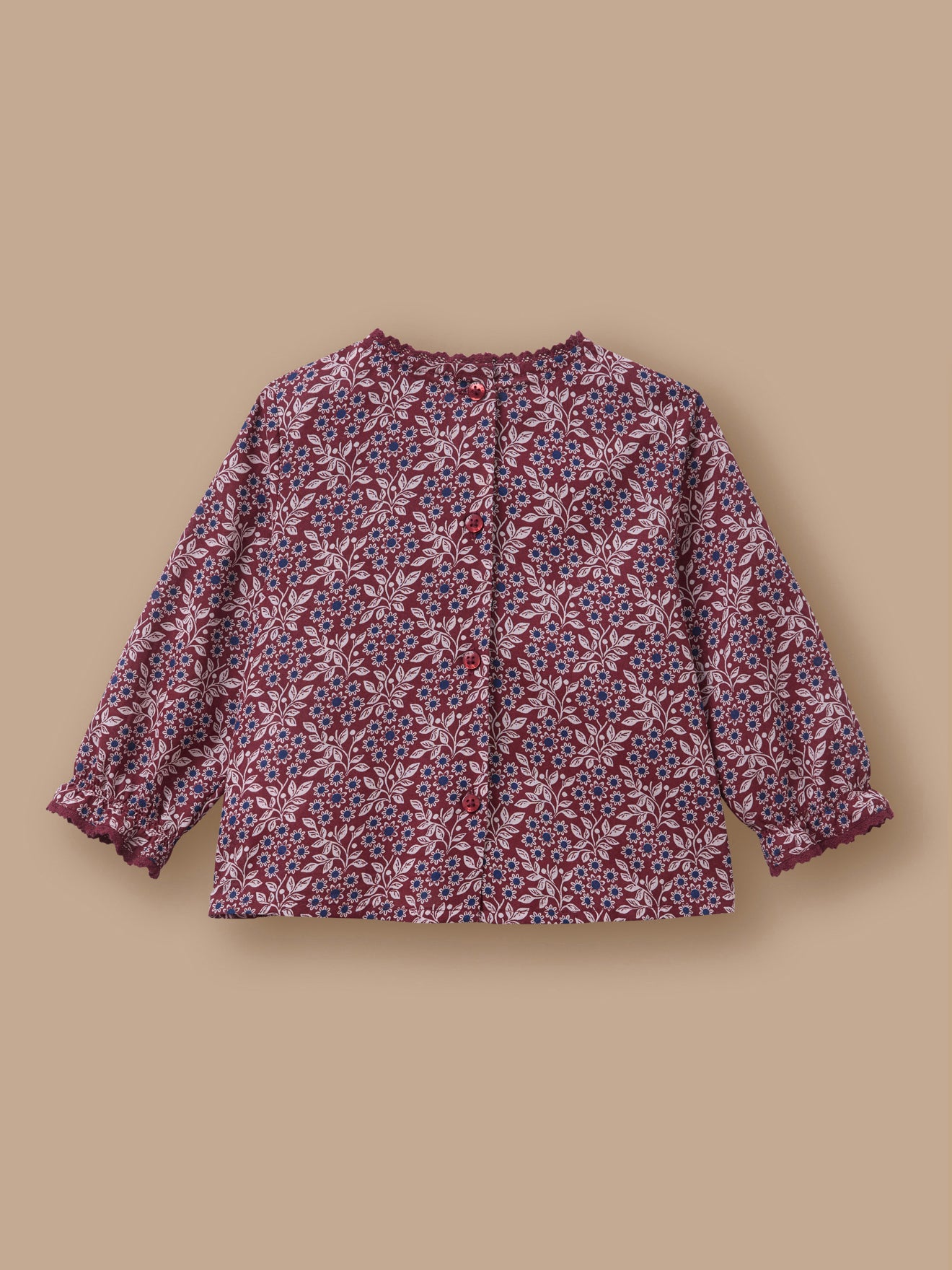 Baby blouse with lace collar and printed pattern