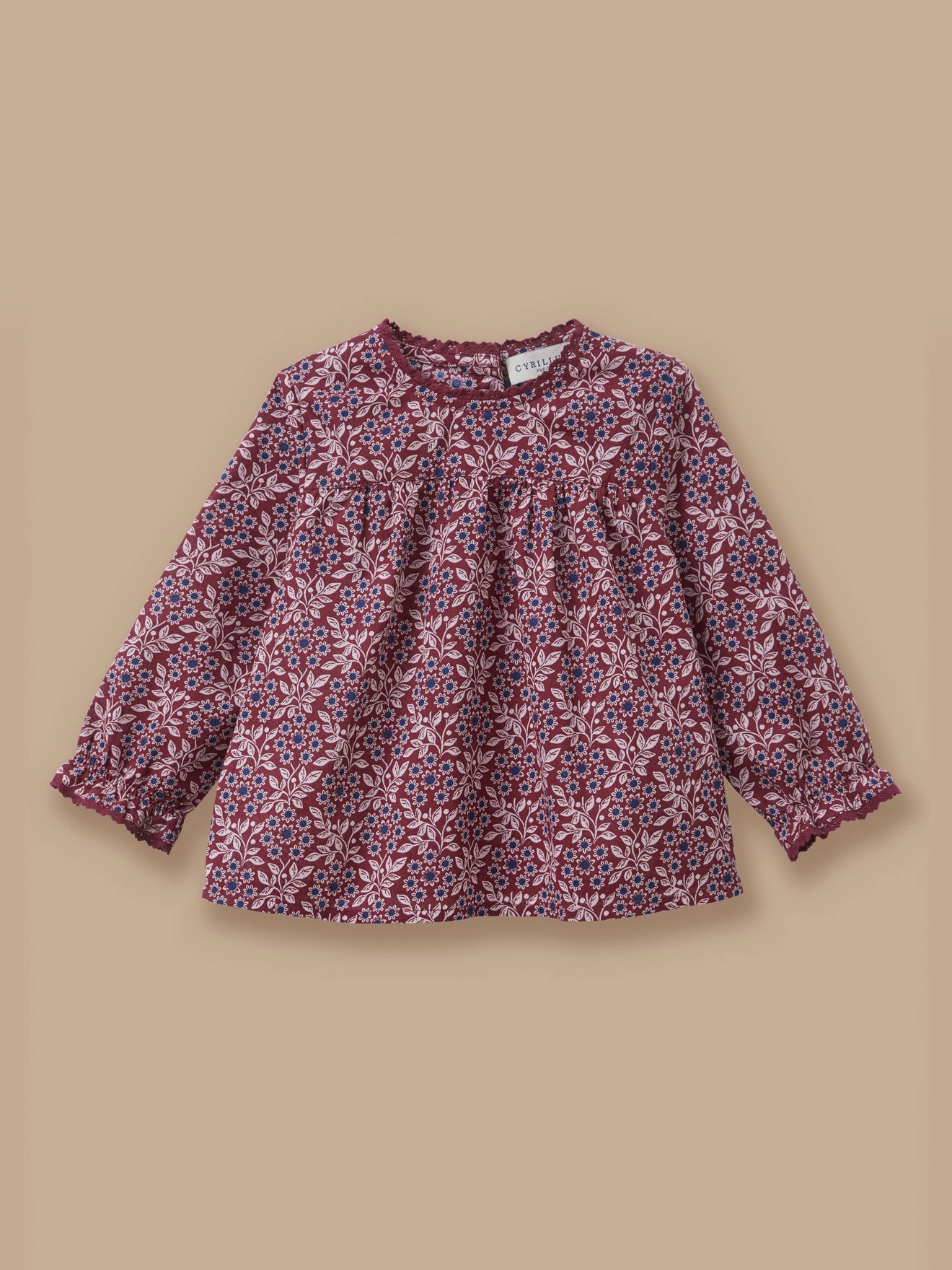 Baby blouse with lace collar and printed pattern