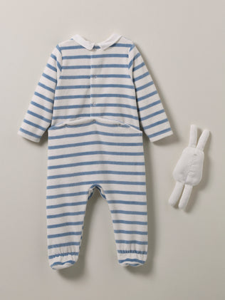 Baby's velour sleepsuit and plush toy