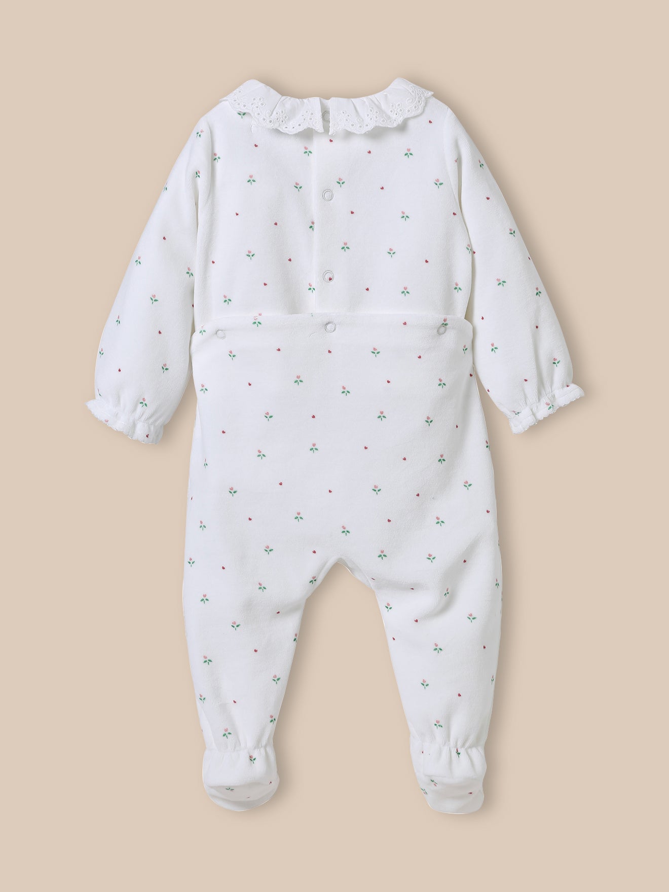 Baby's velour sleepsuit with broderie anglaise collar