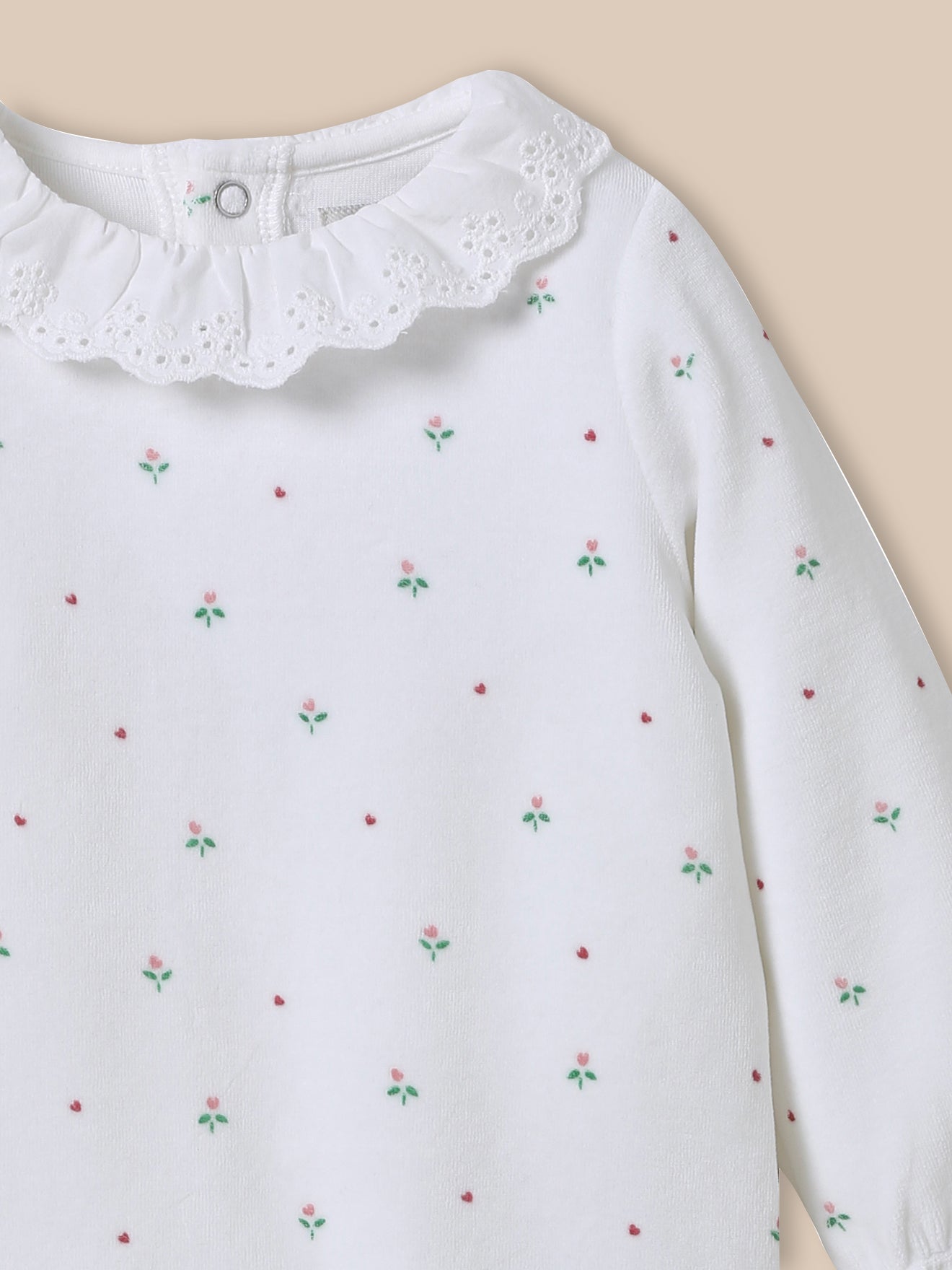 Baby's velour sleepsuit with broderie anglaise collar