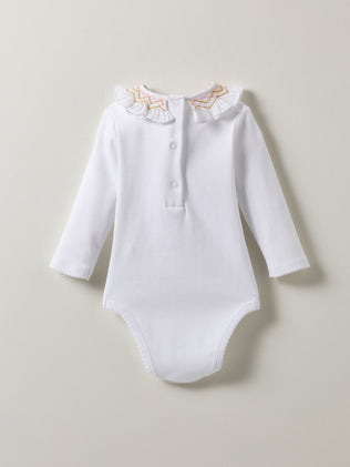 Baby's organic cotton bodysuit with smocked collar