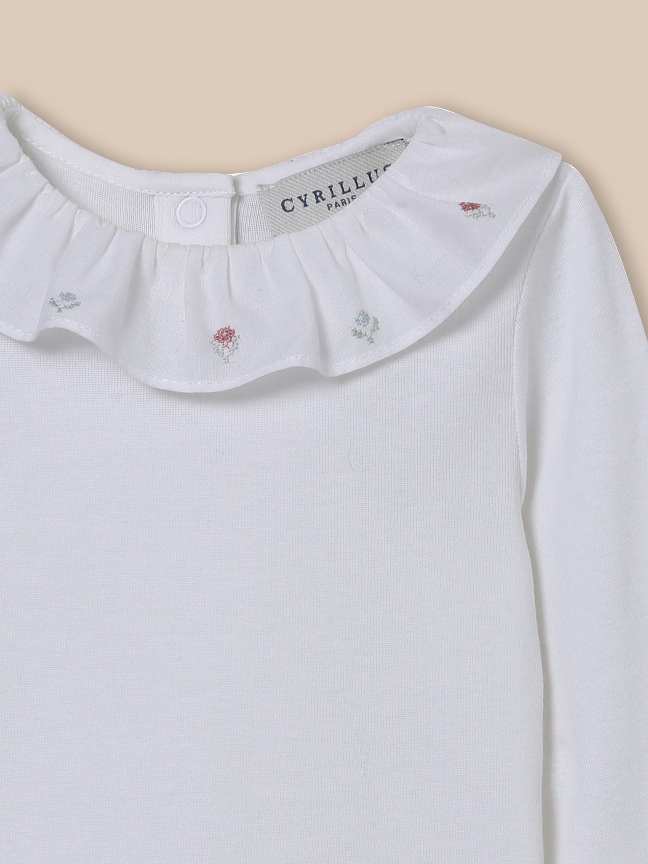 Baby's organic cotton bodysuit with embroidered neckline