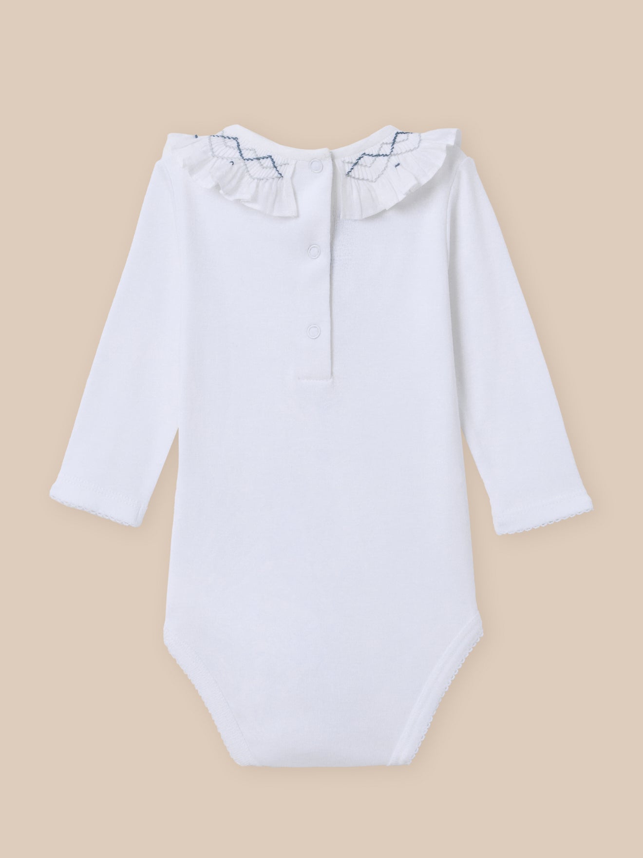 Organic cotton bodysuit with embroidered neckline and smocking
