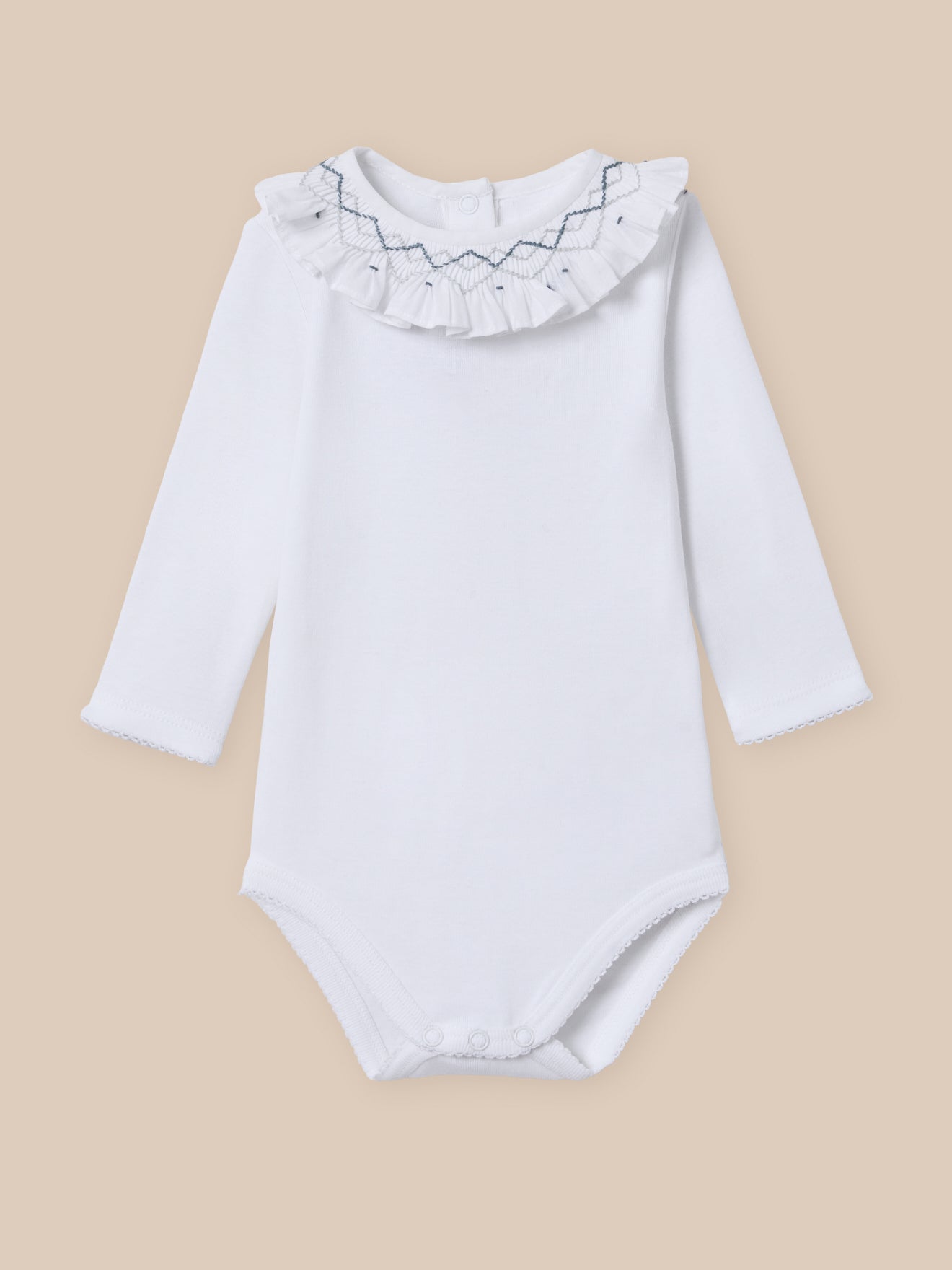 Organic cotton bodysuit with embroidered neckline and smocking