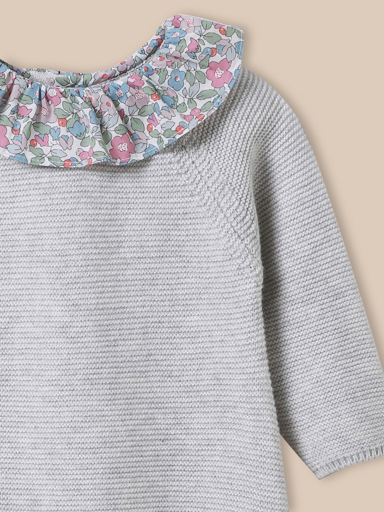 Baby's knit jumpsuit, collar made with Liberty fabric