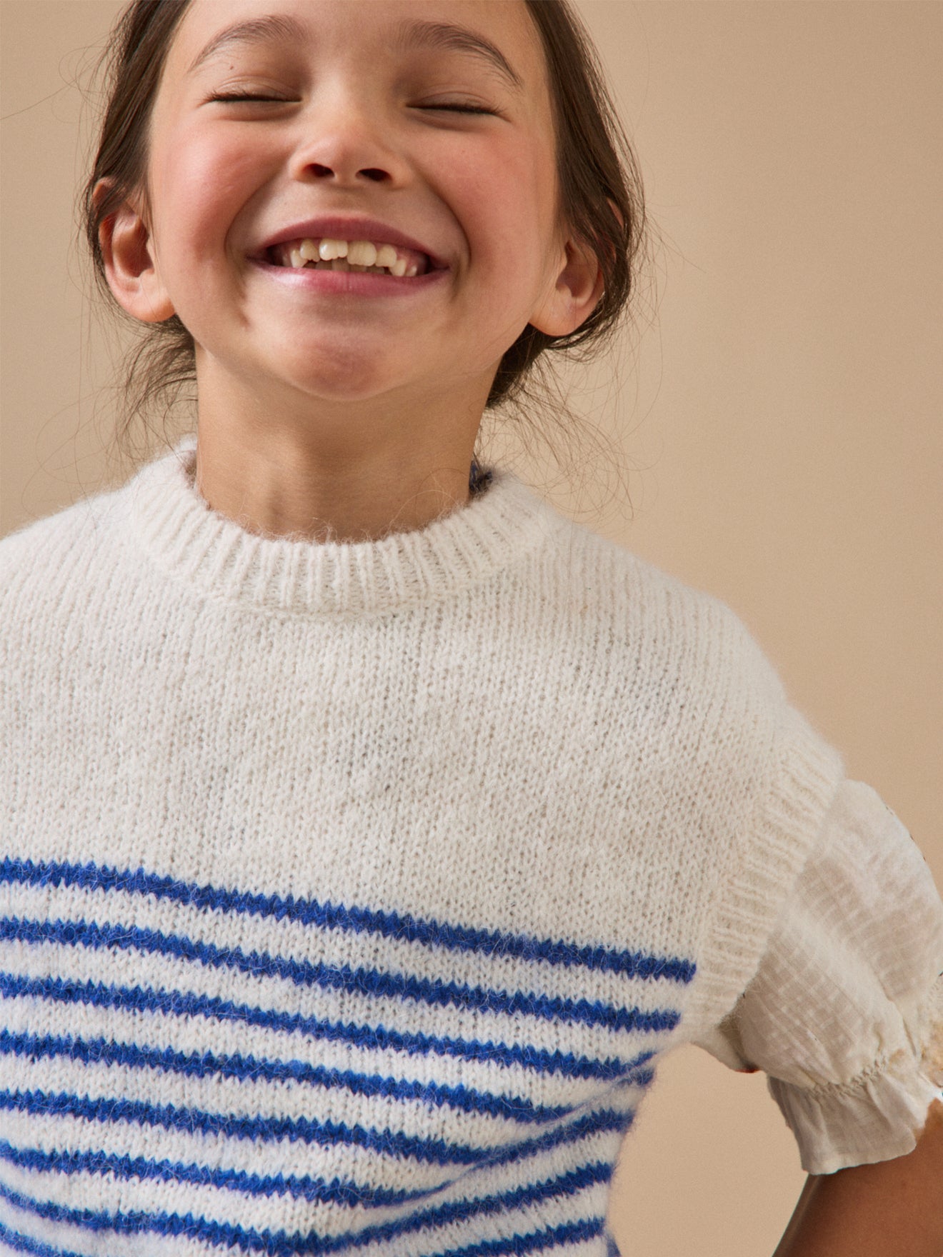 Girl's striped sleeveless sweater