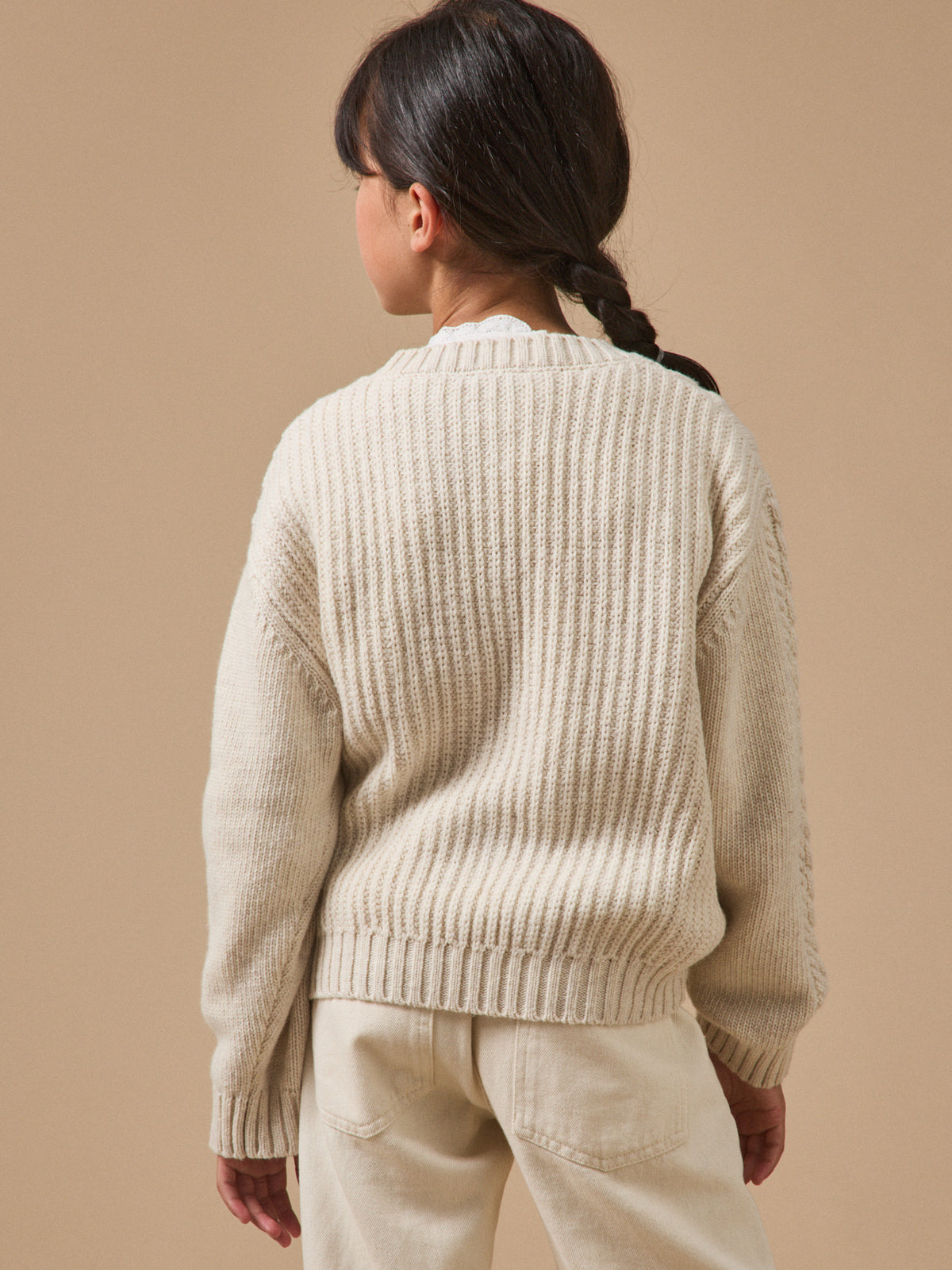 Girl's cable-knit sweater with wool