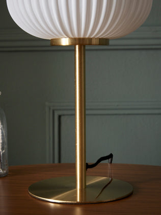 Brass lamp with grooved glass